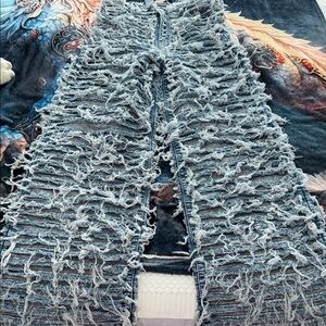 Distressed Shredded Light Blue Denim Jeans